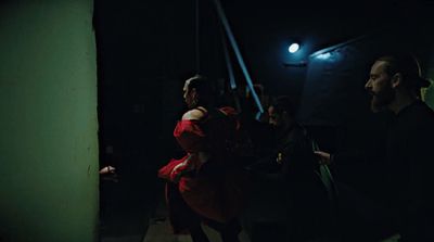 a group of people standing in a dark room