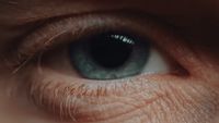 a close up of a person's blue eye