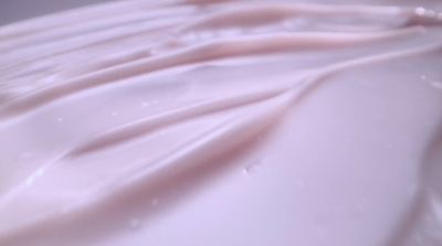 a close up of a white cloth with water droplets