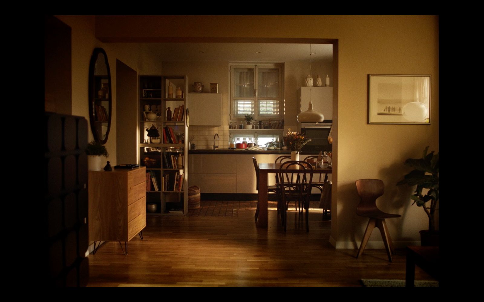 a kitchen with a table and chairs in it