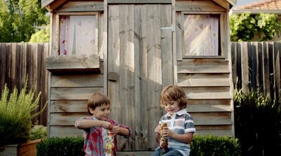 a couple of kids standing next to each other