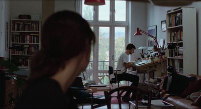 a man and a woman sitting in a living room