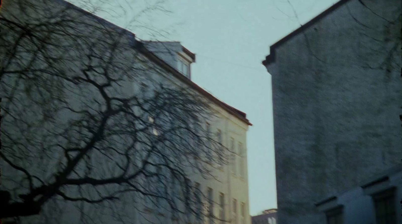 a couple of tall buildings sitting next to each other