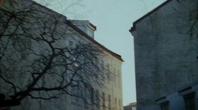 a couple of tall buildings sitting next to each other