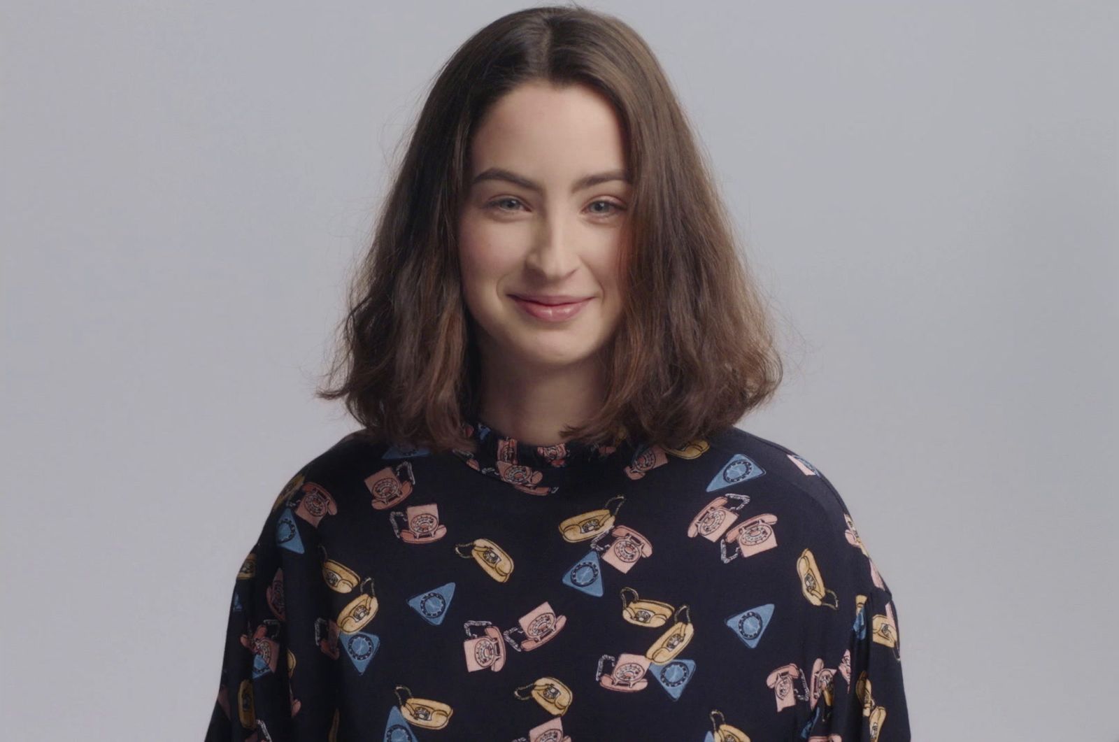 a woman with long hair wearing a black shirt