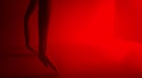 a close up of a red light in a room