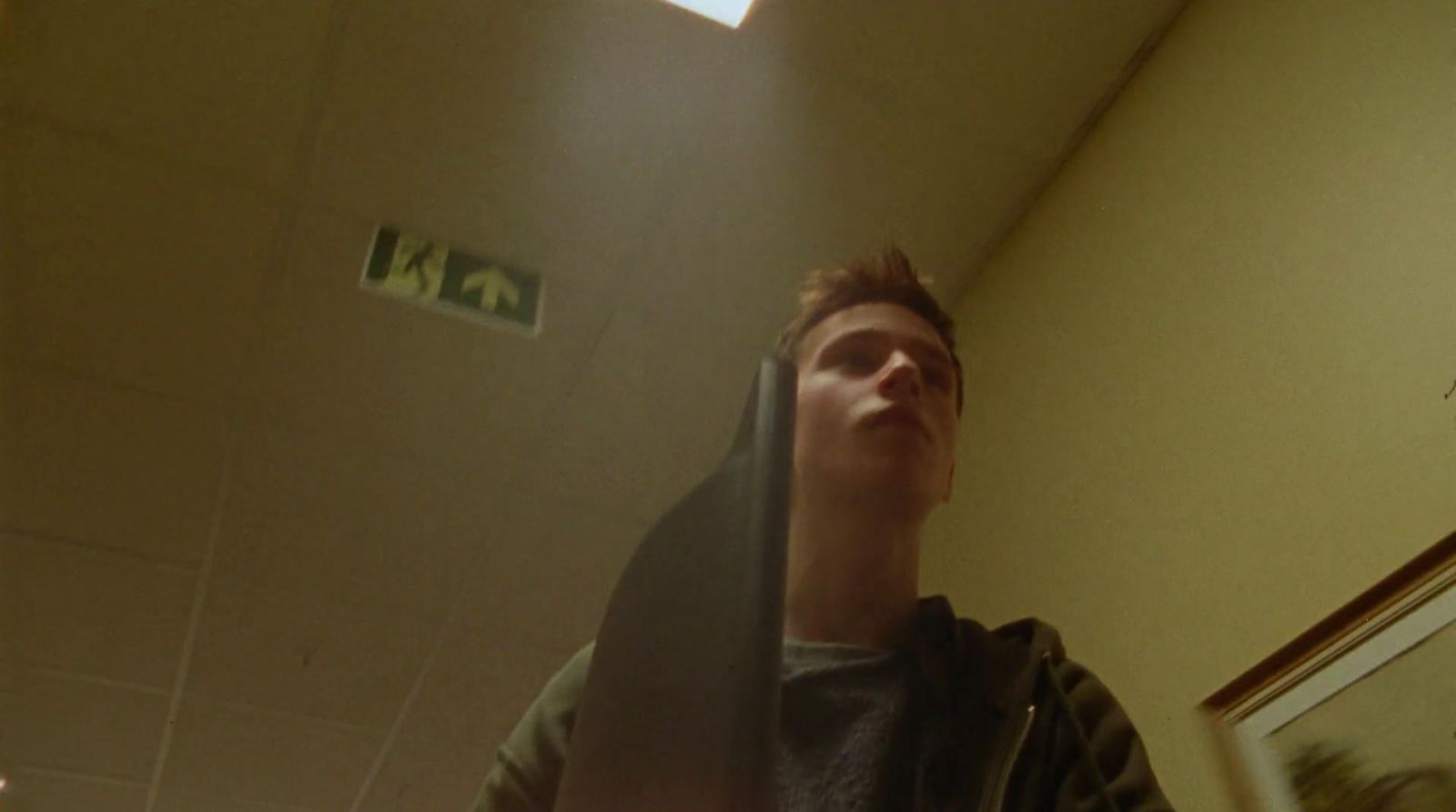 a man standing in a room with his head in the air
