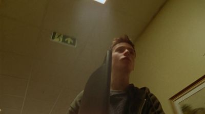 a man standing in a room with his head in the air