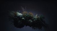 a vase filled with plants and rocks on a table