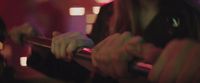 a blurry photo of a person playing a guitar