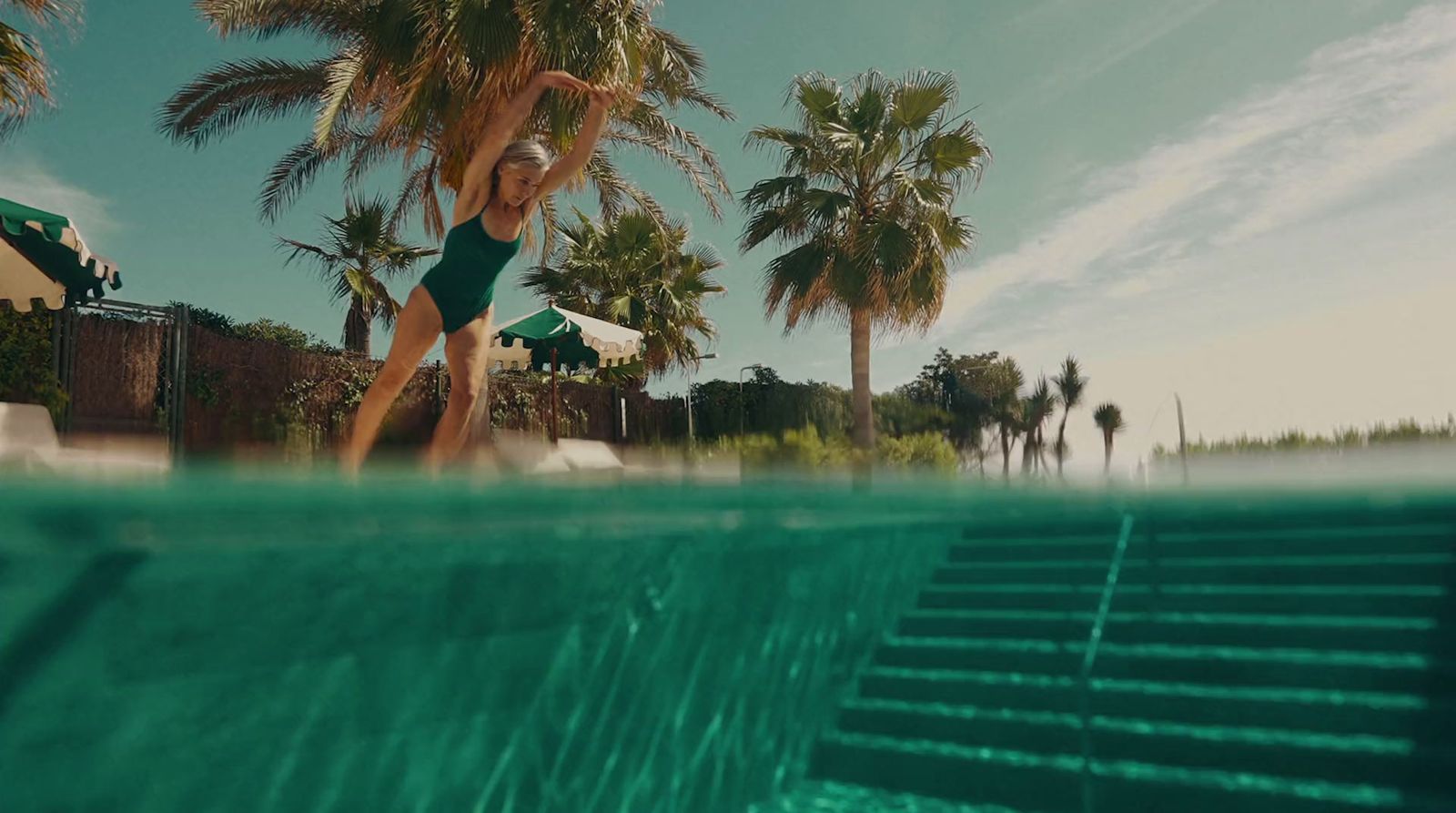 a woman in a bikini standing in a pool