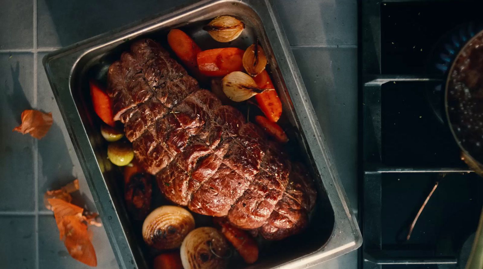 a roasting pan filled with meat and vegetables