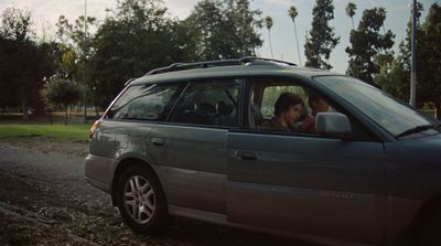a couple of people sitting in a car