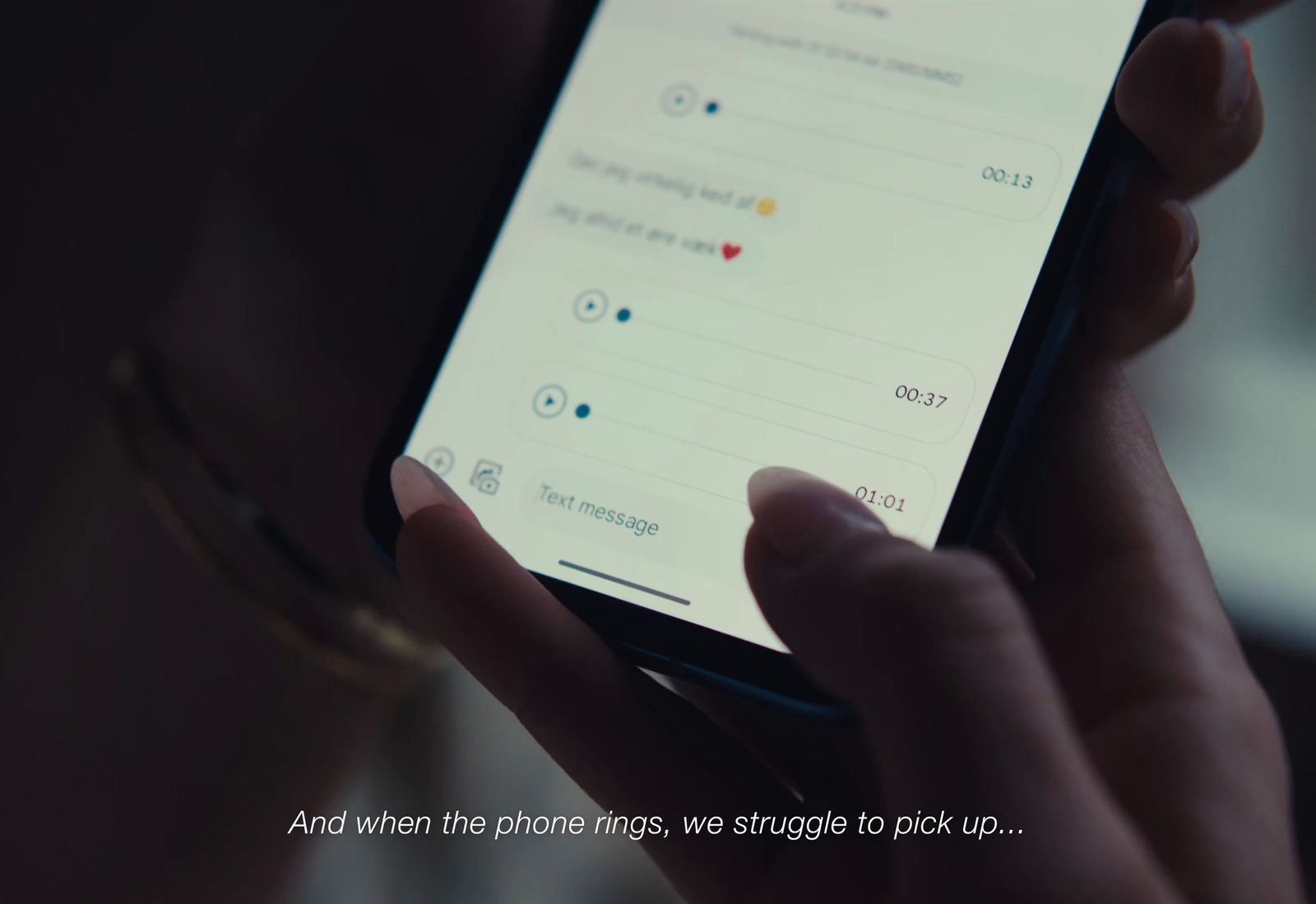 a person holding a cell phone in their hand