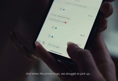 a person holding a cell phone in their hand