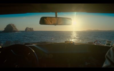 a view of the ocean from inside a vehicle