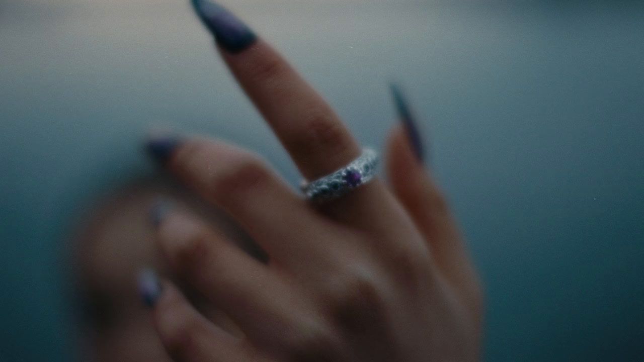 a woman's hand with a ring on it