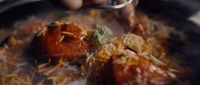 a close up of a plate of food with a spoon