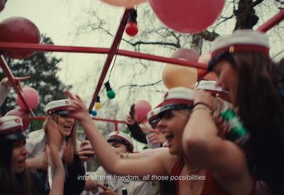a group of people standing around each other