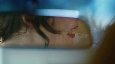 a reflection of a woman's face in a mirror