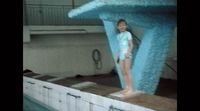 a young girl standing on top of a floating pool