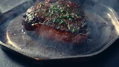 a close up of a piece of meat on a pan