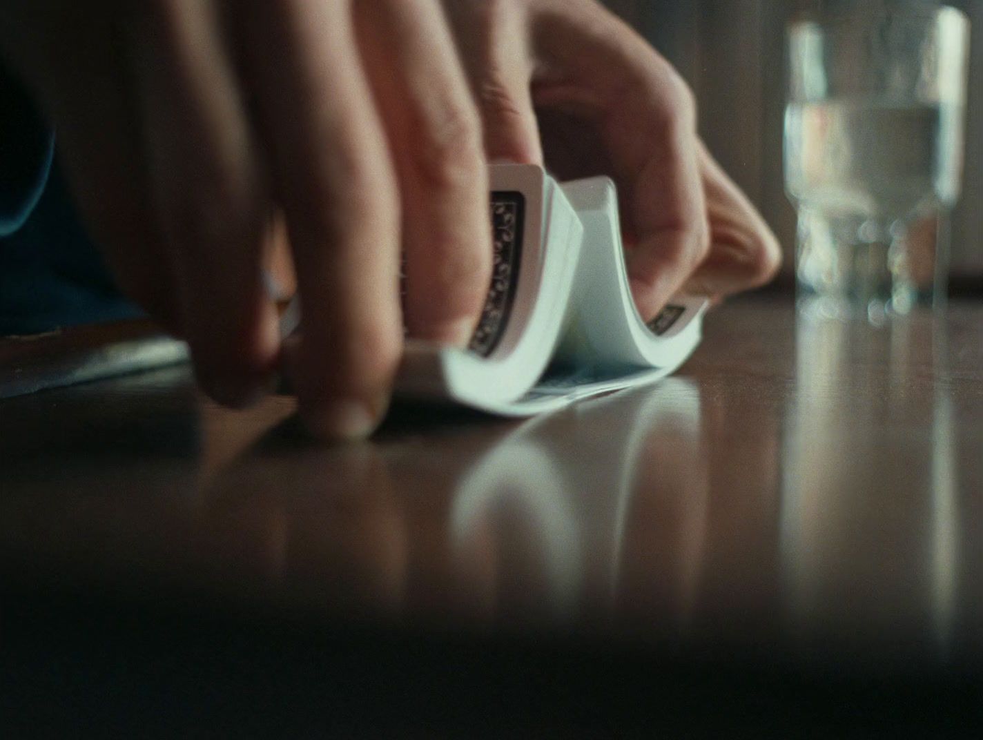 a close up of a person using a device on a table