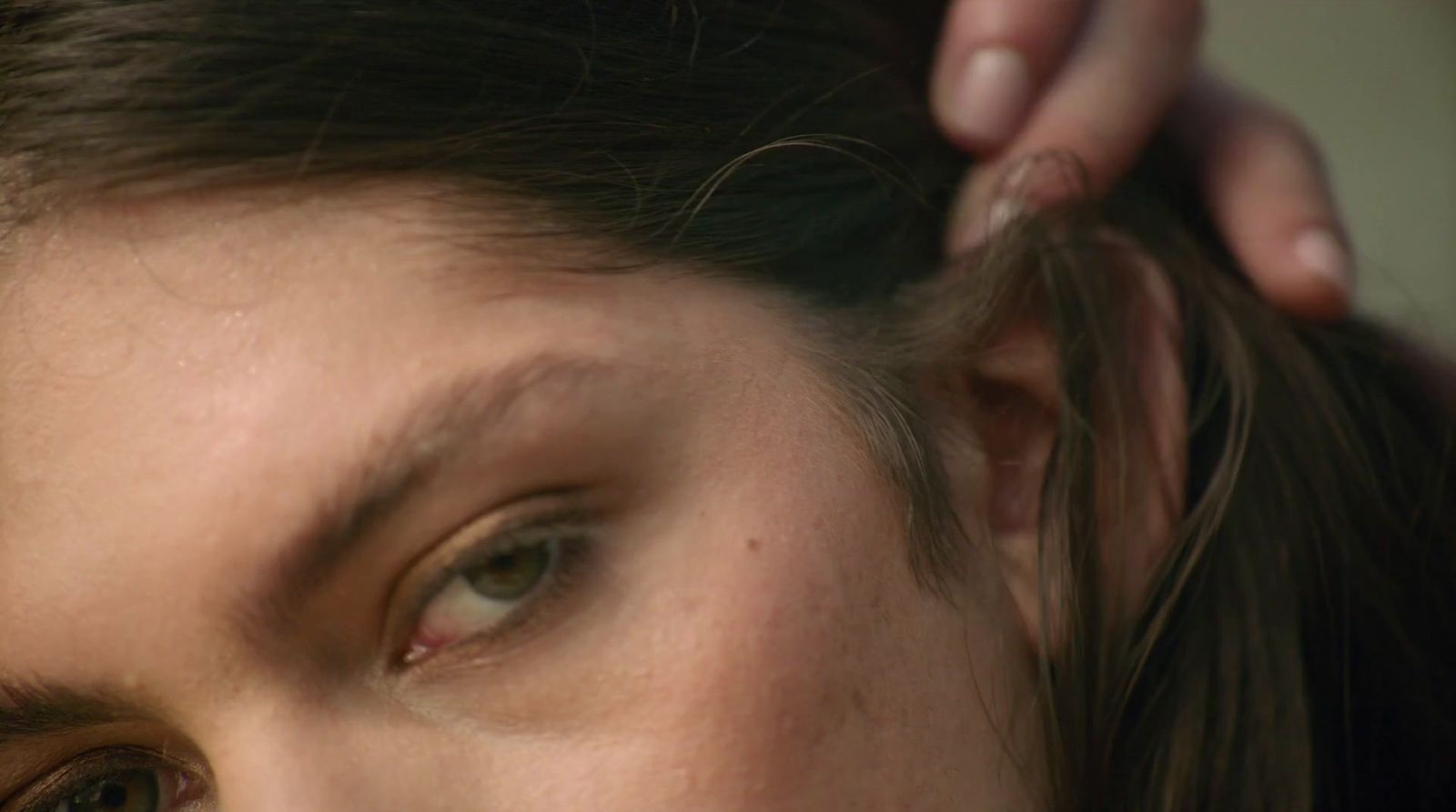 a close up of a woman getting her hair done
