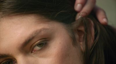 a close up of a woman getting her hair done