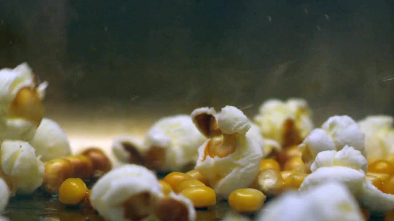 a close up of popcorn kernels and corn kernels