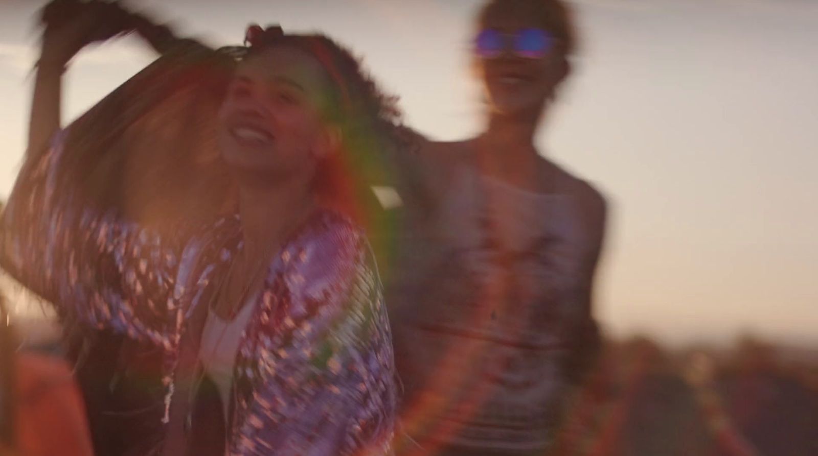 a blurry photo of two people standing next to each other