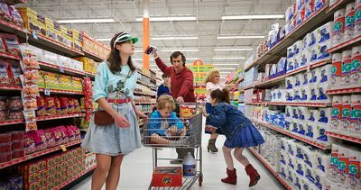 a group of people shopping in a grocery store