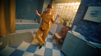 a person in a room with a checkered floor