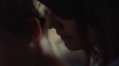 a close up of a person's face with a blurry background