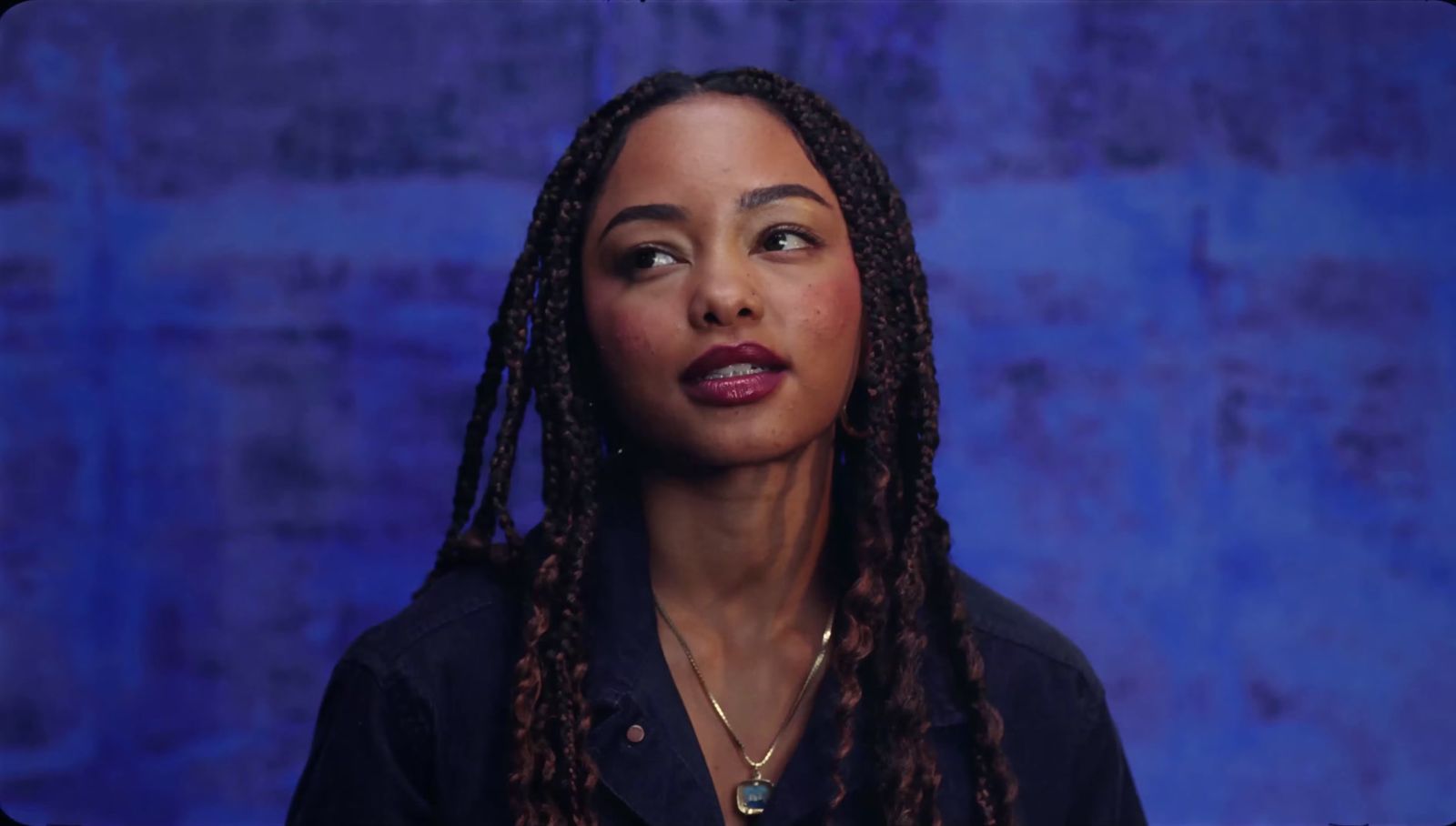 a close up of a person with dreadlocks