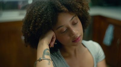 a woman with a tattoo on her arm