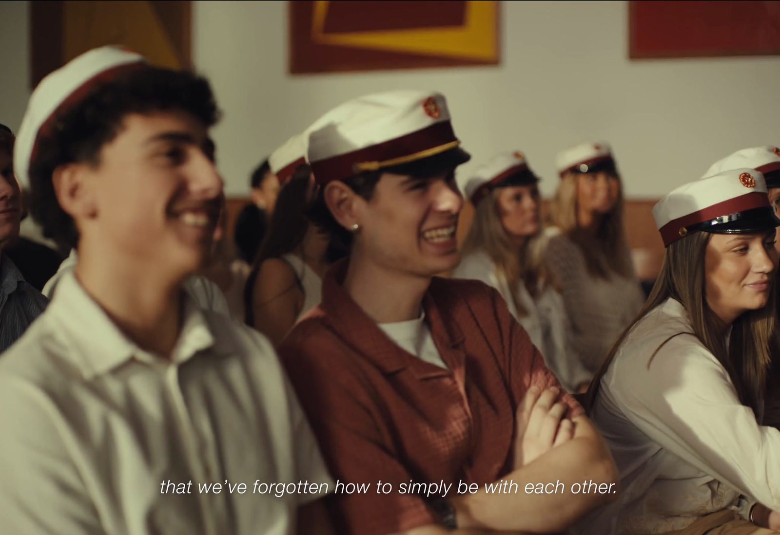 a group of people sitting next to each other