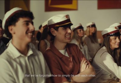 a group of people sitting next to each other