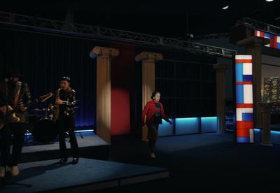 a group of people standing on top of a stage