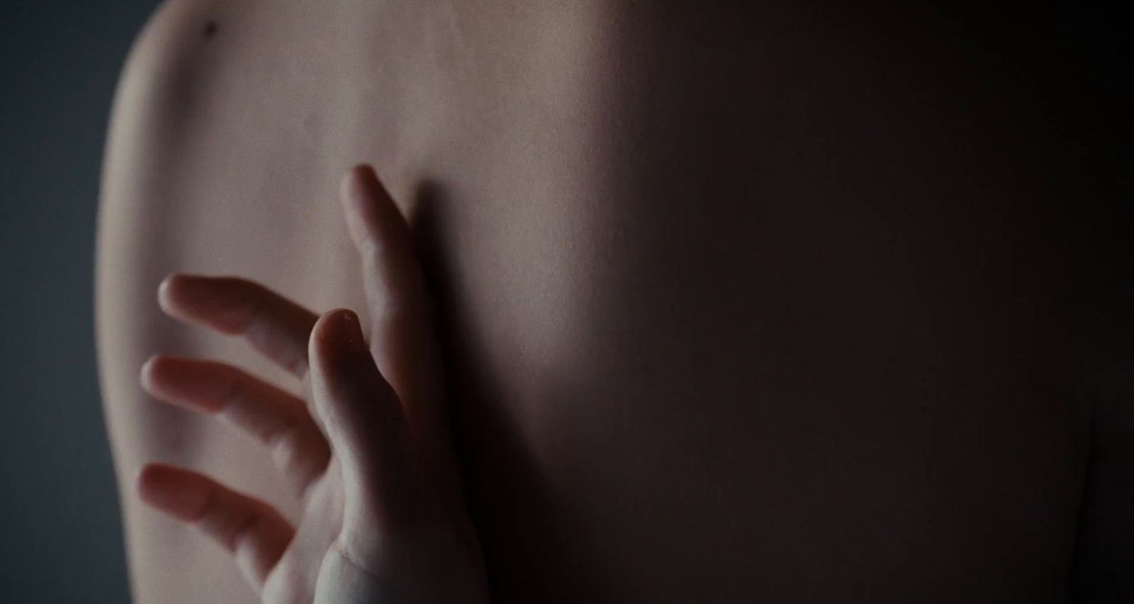 a woman's arm with a ring on it