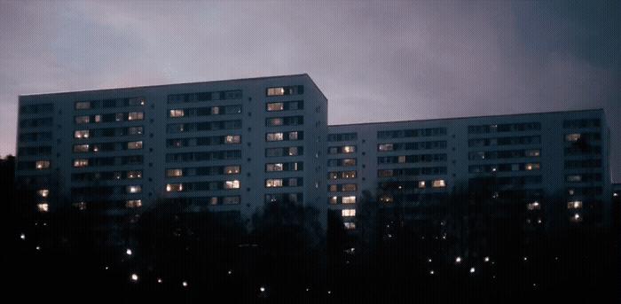 a very tall white building with lots of windows