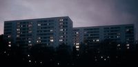 a very tall white building with lots of windows