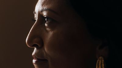 a close up of a person wearing earrings