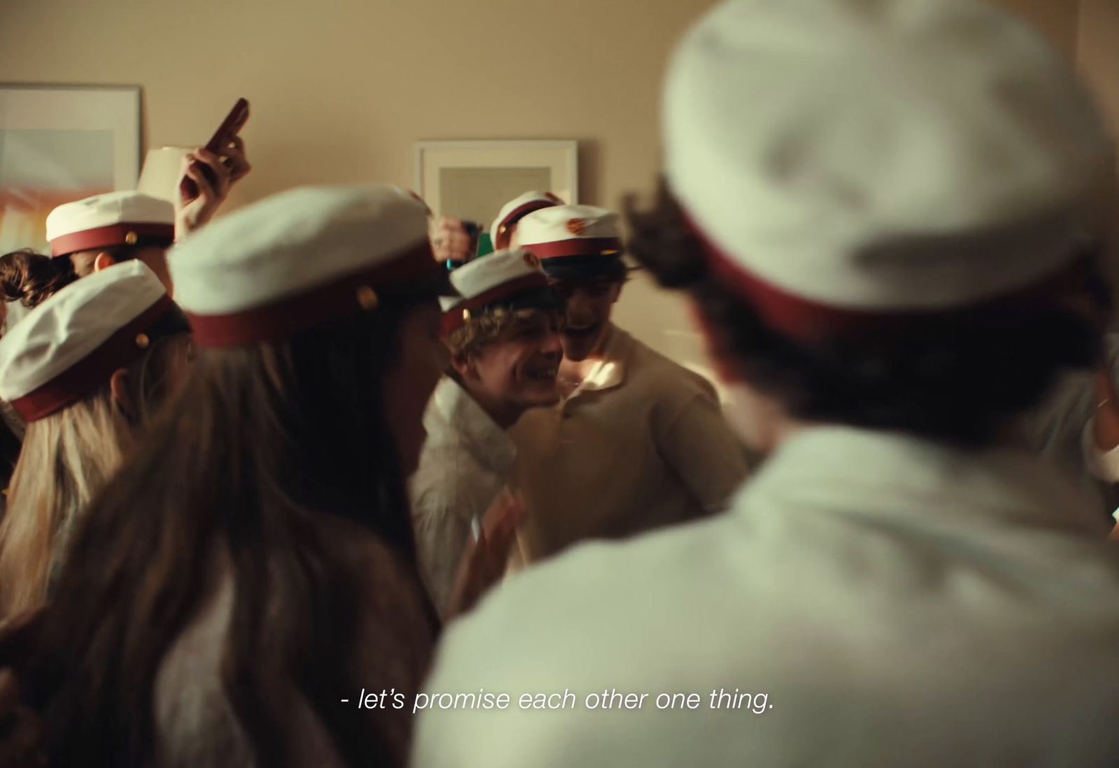 a group of people wearing white and red hats