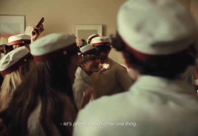 a group of people wearing white and red hats