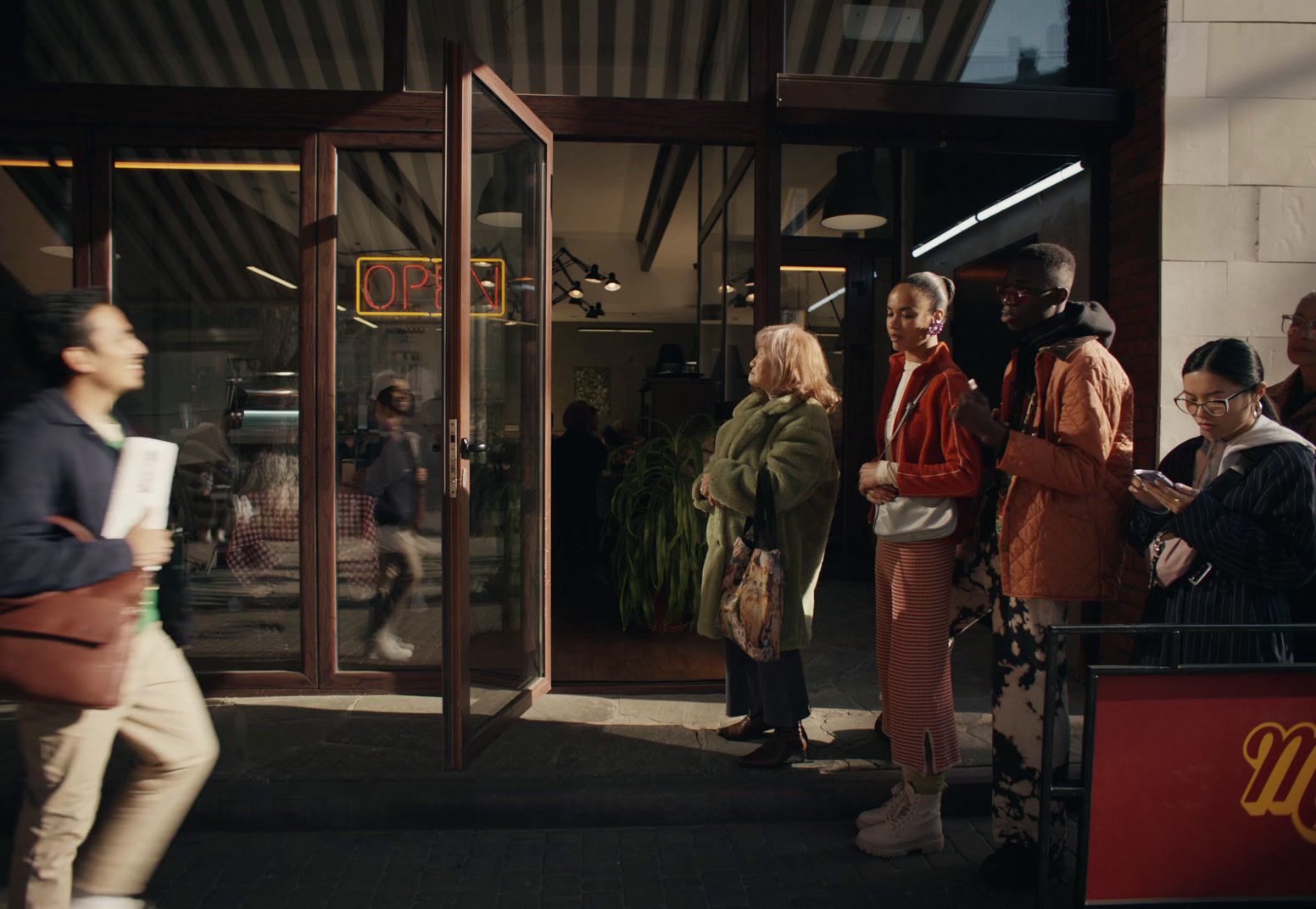 a group of people standing outside of a building