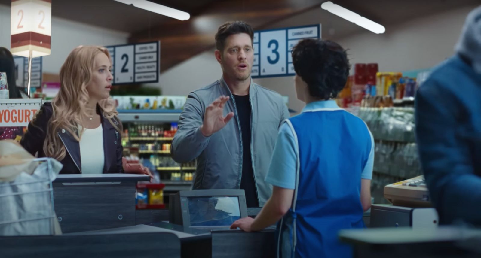 a group of people standing around a store