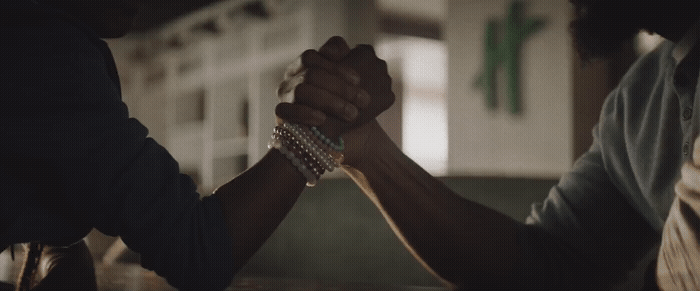 a couple of people that are holding hands