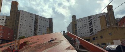 a group of people standing on top of a roof