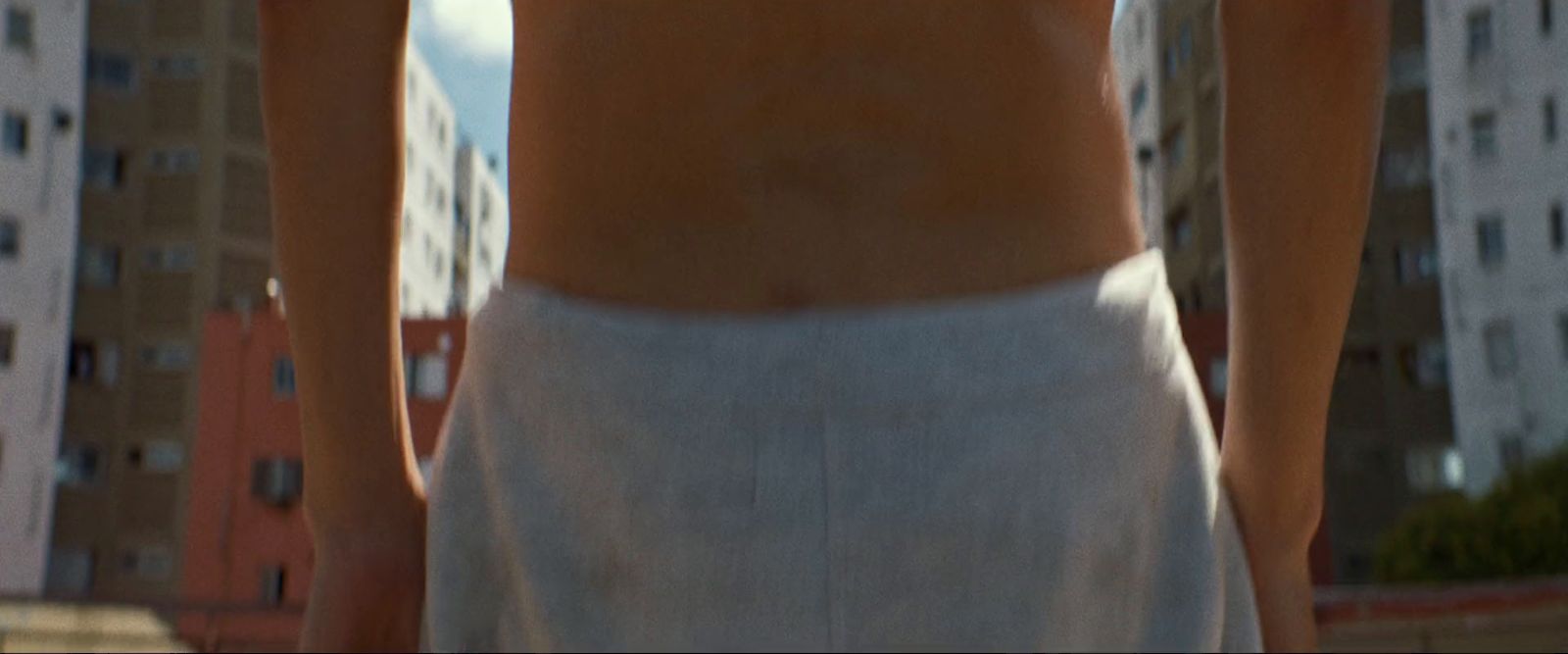 a close up of a person wearing a white skirt